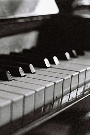 Closeup on the keys of a piano (black & white)