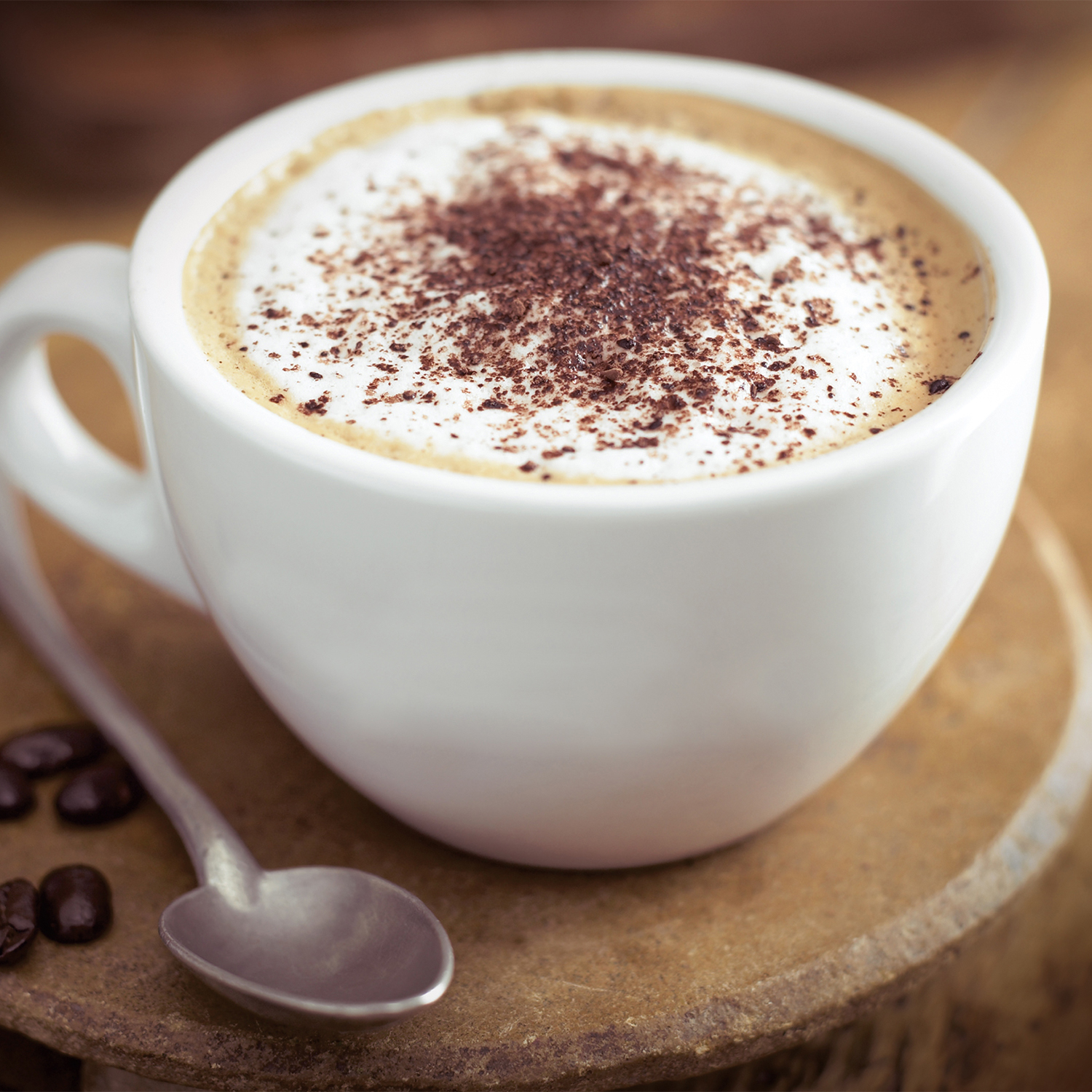 Closeup on a cappuccino in a white ceramic mug