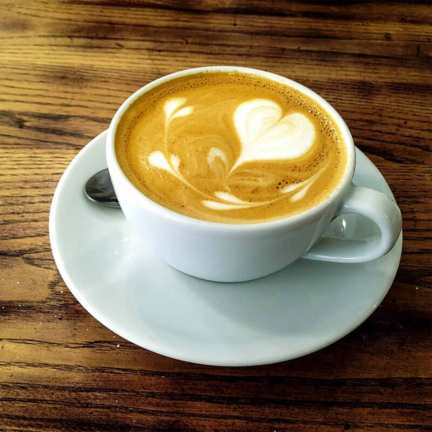Closeup on an espresso with heart-shaped latte art