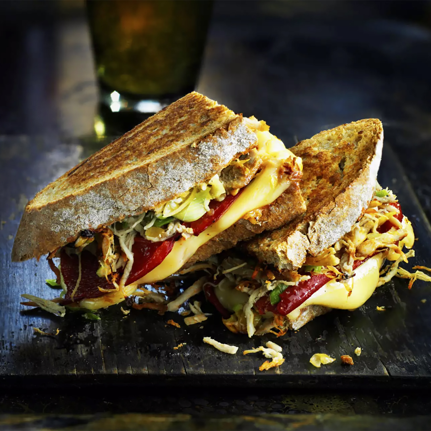 Closeup on a pulled pork sandwich on a wooden board